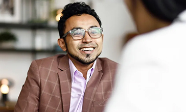 man in a brown blazer